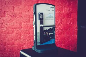 Door lock systems on display with red background